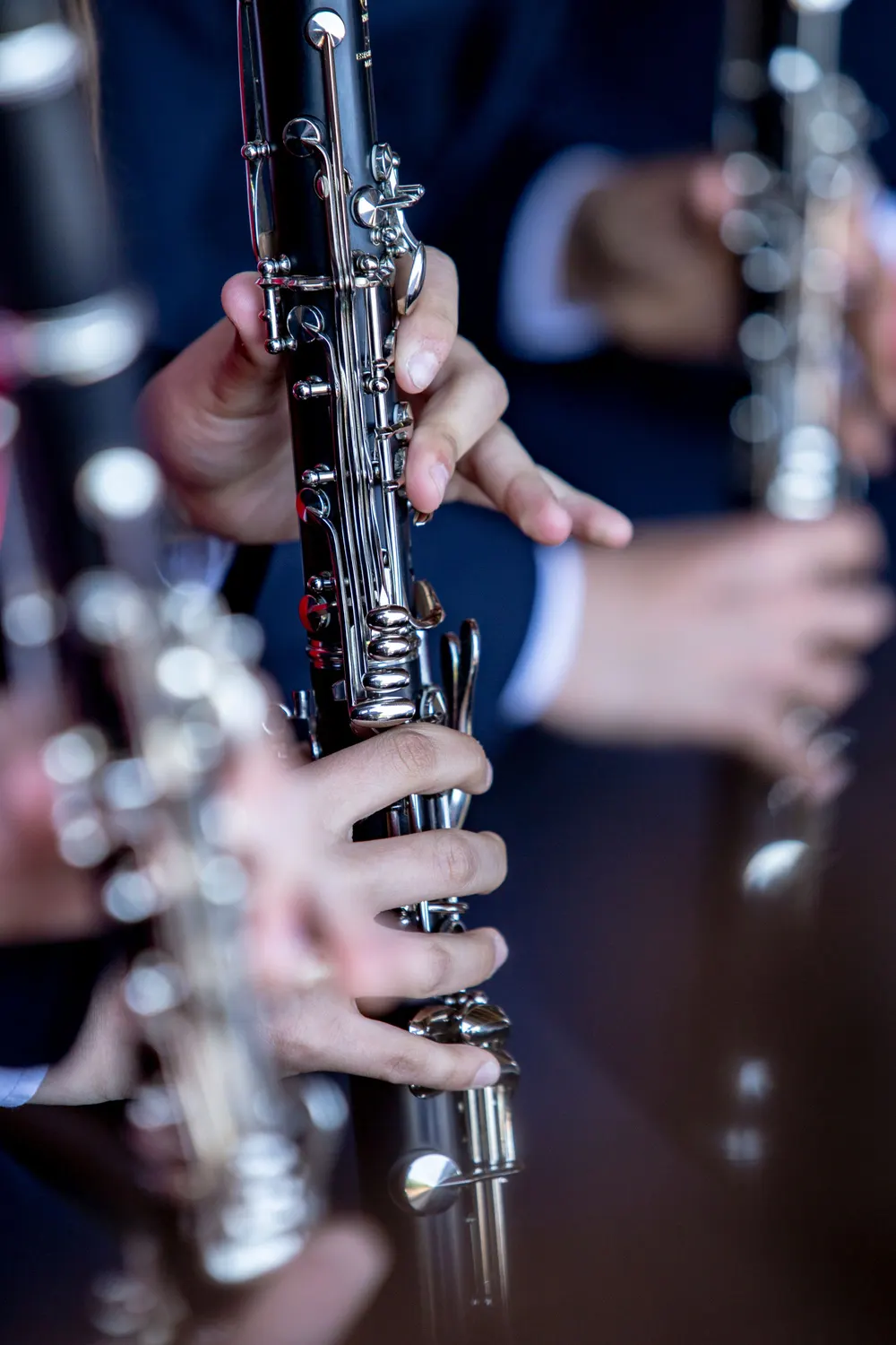 Fingers on the keys of a clarinet